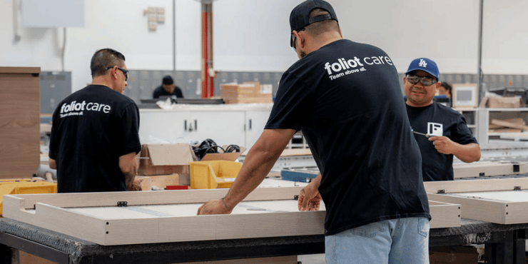 Foliot’s specialized installation team prepares to install dorm room furniture.